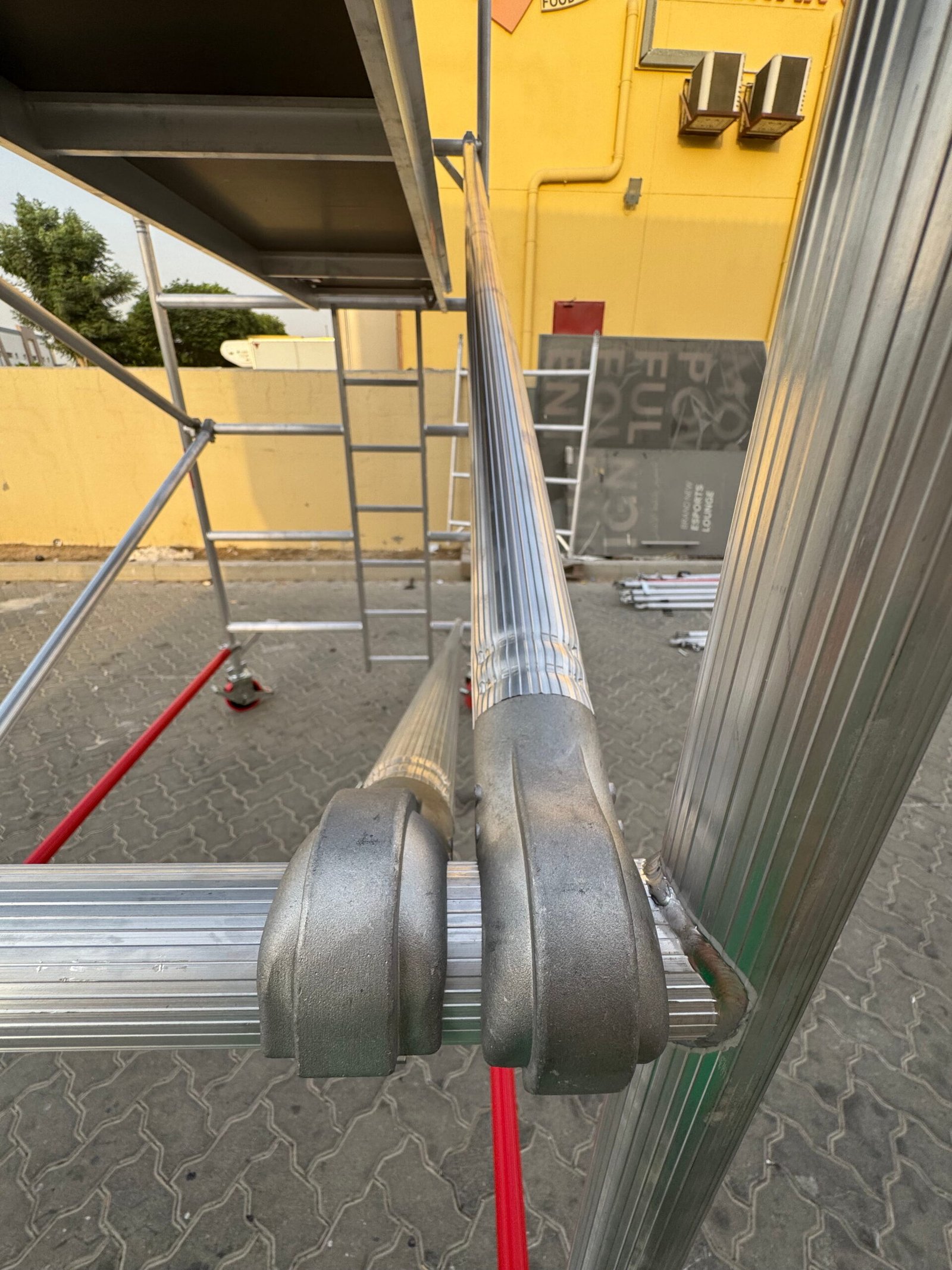 Double-width aluminium scaffold tower providing large working platform for construction projects.