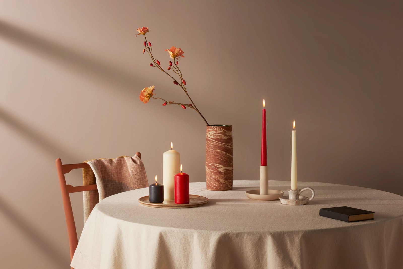 Elegant decorative candle collection displayed as part of luxury home décor styling.