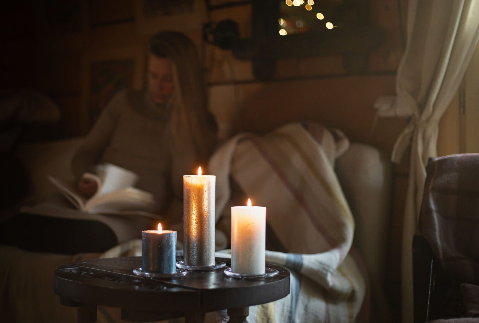 Premium scented candle collection displayed in an elegant luxury living room environment.